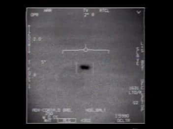 Pantalla del pod en modo TV: una forma oscura y alargada en el centro sobre fondo gris.