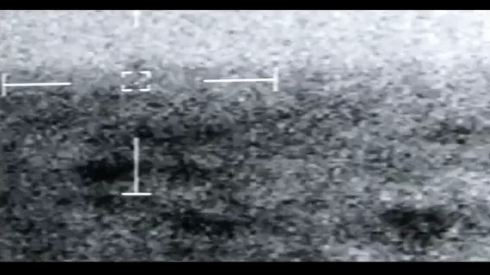 The same view nine seconds later: the tracking box, now dashed, is empty over the boundary between sky and sea.